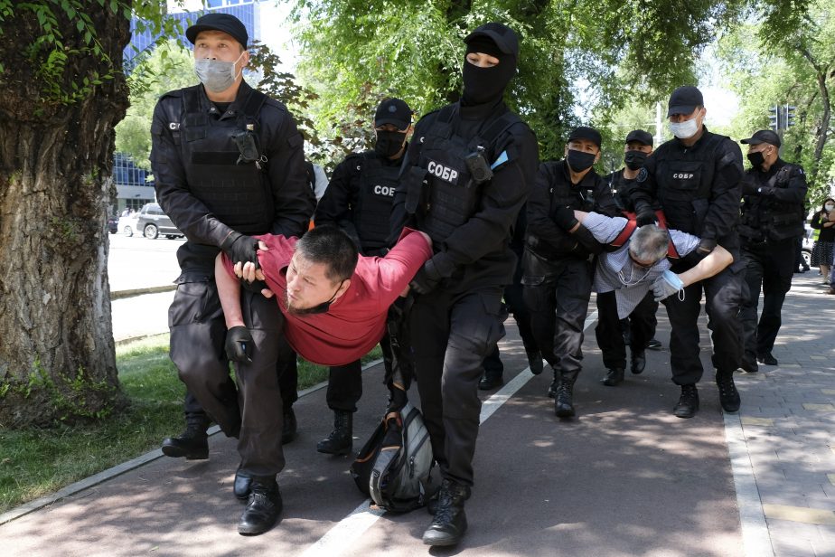 Police wearing face masks to protect against coronavirus, detain protesters during an unsanctioned protest in Almaty, Kazakhstan, Saturday, June 6, 2020.  Credit: AP Photo/Vladimir Tretyakov